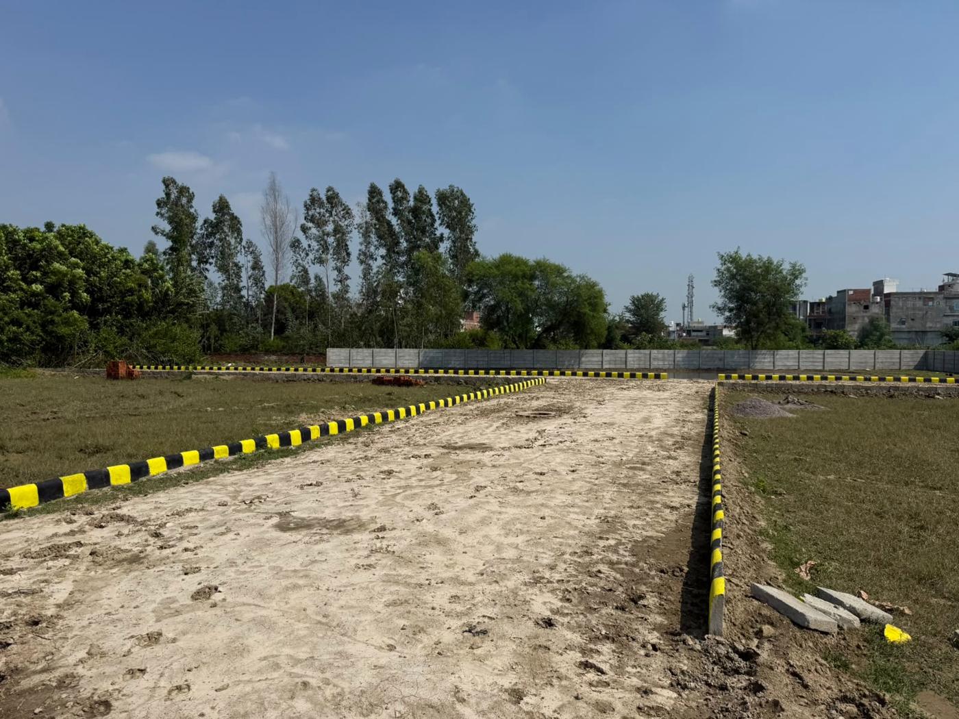 Internal road at Rudra Vihar with marked plots on both sides