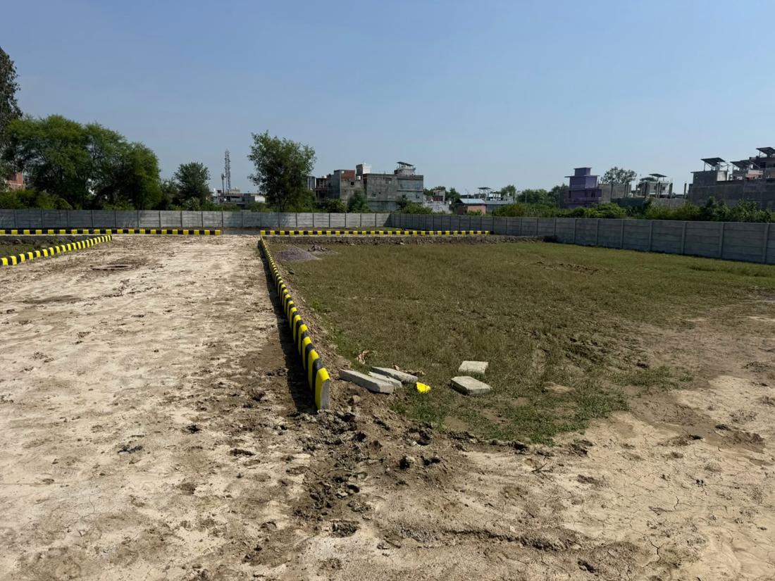Rudra Vihar plots with the concrete boundary wall